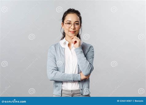hmm very interesting portrait of intrigued cute asian woman making choice deciding between