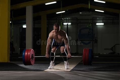 Young Athlete Getting Ready For Weight Lifting Training Stock Photo