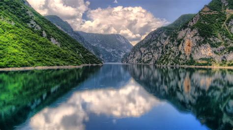 Beautiful Calm River Between Green Trees Covered Mountains Reflection