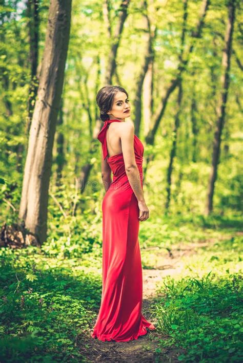 Woman In Long Red Dress Walking In The Forest Stock Photo Image Of