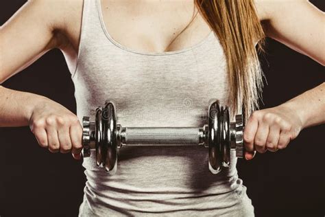 closeup arm strong woman lifting dumbbells weights stock image image of strong biceps 66538077