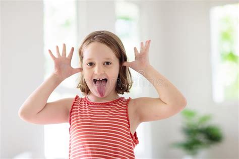Child Funny Face Kid Teasing Girl Laughing Stock Photo