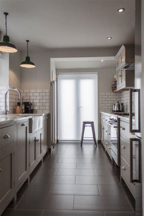 Explore more small kitchens with dark cabinets designs and decorating ideas with our collections below. Kitchen: grey cabinets, subway tile, barn lights | Galley ...