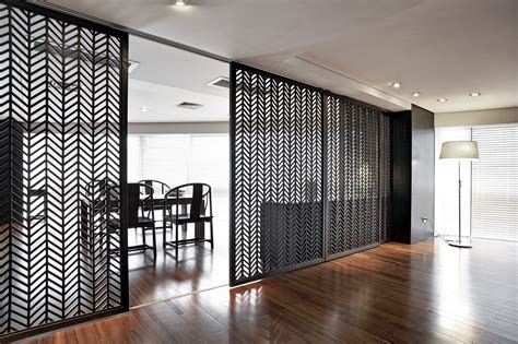 The Room Divider Is Made Out Of Metal And Has An Intricate Design On It