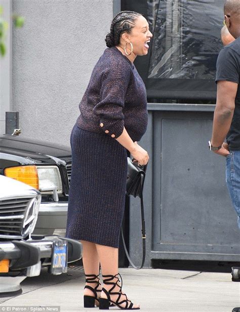 Pregnant Tia Mowry Covers Her Growing Baby Bump In Chic Black Ensemble