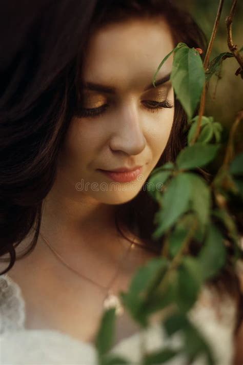 Close Up Of Beautiful Female Bride Face Gorgeous Sensual Brunette Woman Looking Down Near Tree