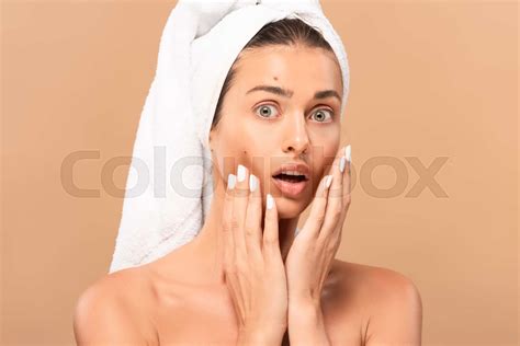 Surprised Naked Girl Touching Face With Pimples And Looking At Camera