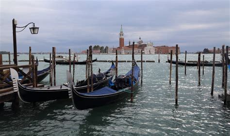 Gondolas And San Giorgio Maggiore Island In Venice Italy Stock Photo