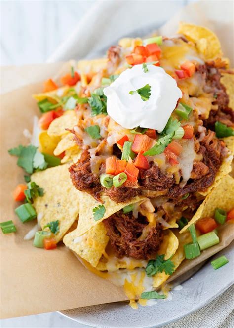 Pour your undrained can of rotel on top of the chicken sprinkle with taco seasoning cover the crockpot and cook on high for three to four hours, or on low for six to eight hours. Slow Cooker Shredded BBQ Chicken Nachos - Baked Bree