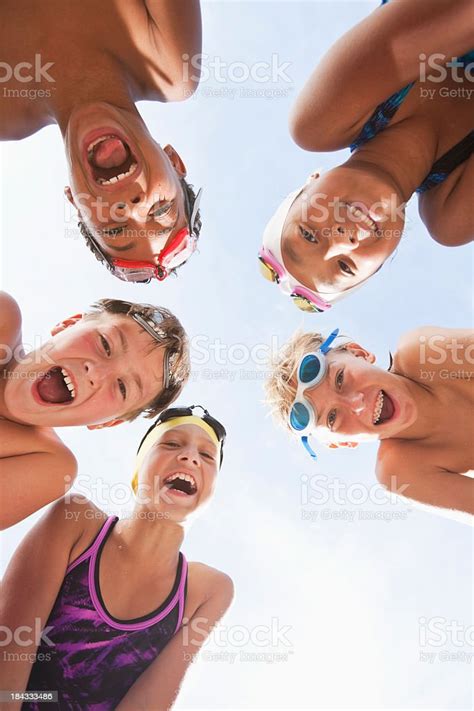 Happy Swimmers In A Huddle Stock Photo Download Image Now Child