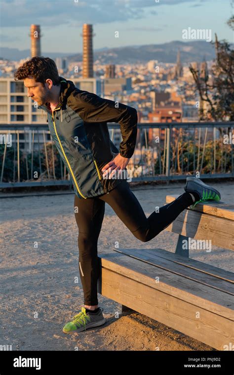 Runner Stretching Leg On The Table Stock Photo Alamy
