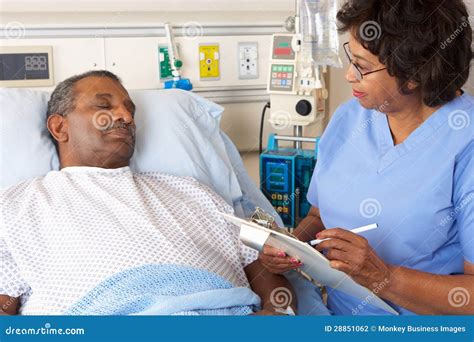 Nurse Talking To Senior Male Patient On Ward Stock Photo Image Of