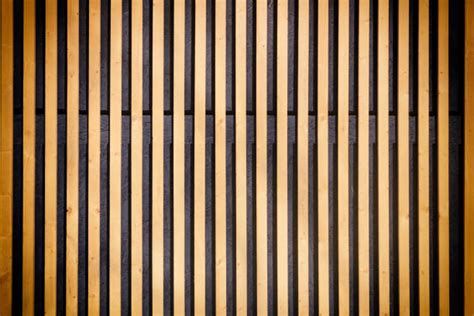 A Wooden Wall With Vertical Lines Painted On It