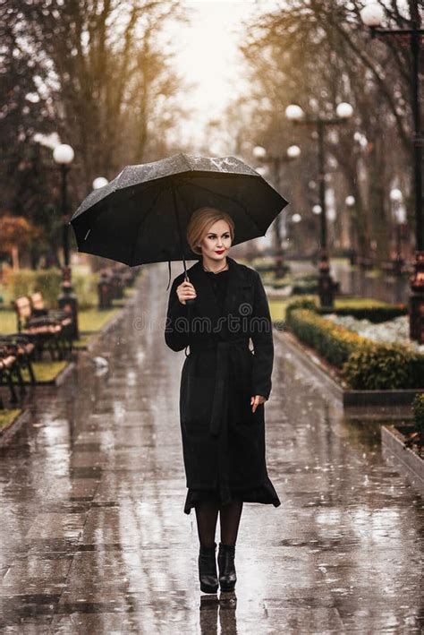 Woman With Umbrella In The Rain Stock Photo Image Of Blond Lady