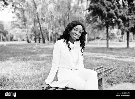 Portrait Of Pretty Black African American Girl Sitting On Bench At