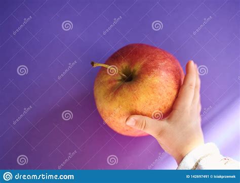 Hand Of A Baby Grabbing An Apple From A Table Stock Image Image Of