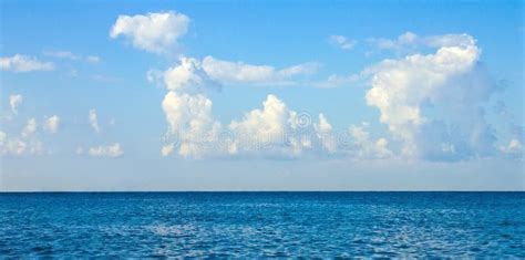 White Cumulus Clouds In The Sky Over The Sea Stock Image Image Of