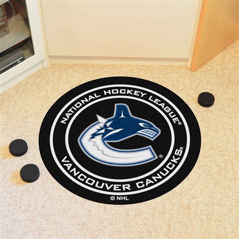 fanmats® 10285 vancouver canucks 27 dia nylon face hockey puck floor mat with jumping orca