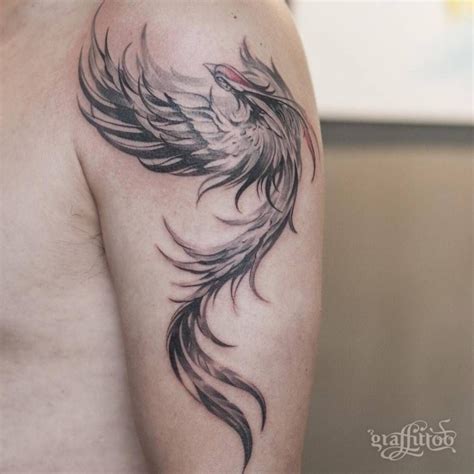 A Man With A Tattoo On His Arm Has A Black And White Bird Design On It