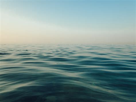 Calm Water Of Ocean During Daytime Photo Free Water Image On Unsplash
