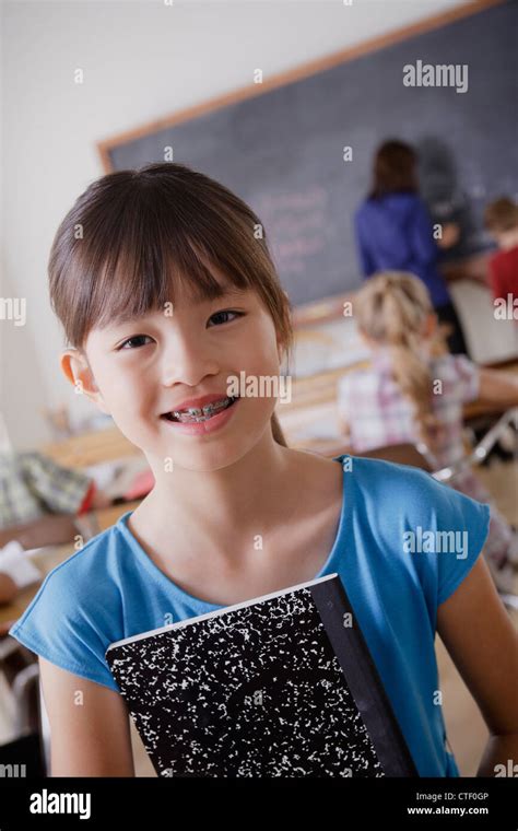 Usa California Los Angeles Portrait Of Schoolgirl Holding Notebook