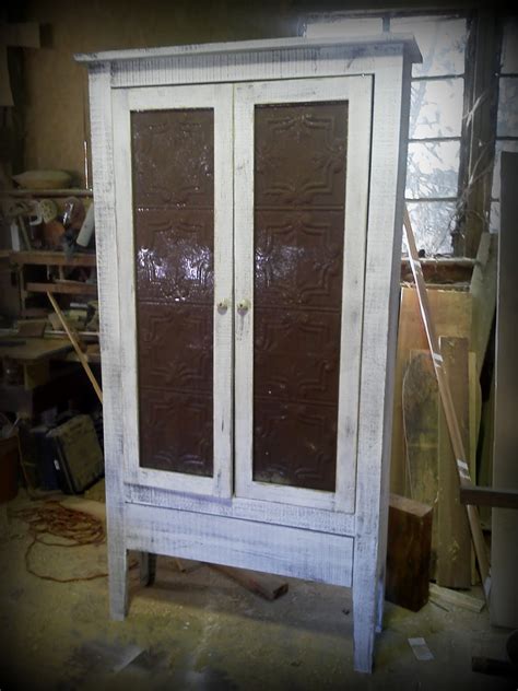 The idea of not having to drill into my metal apartment door is awesome, and i dont want to risk damaging paint with a sticky hook. Backyard Solutions of Alabama: Cabinet with tin inserts