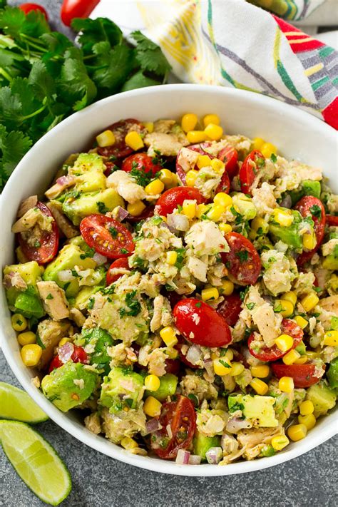 Stir until well mixed and then taste. A serving bowl of avocado tuna salad filled with veggies ...
