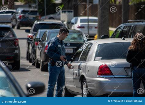 A Detective From Lapd S Metro Division Enters His Car After Valley