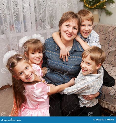 Four Children Hugging Mother. Family Concept. Stock Photography - Image