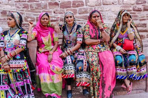 Beautiful Indian Women In Traditional Rajasthani Clothes Preparing To Dance At Annual Camel Fair