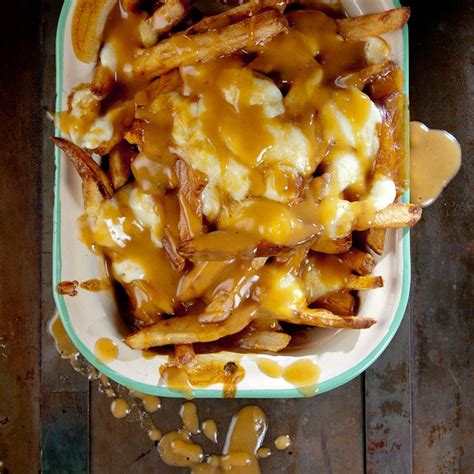 Poutine Aka Canadian French Fries Delivers A Cheesy Deep Fried