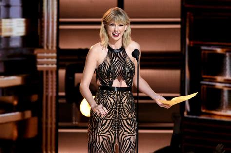 After Pregnancy Rumors Taylor Swift Wears Sheer Gown To Country Music