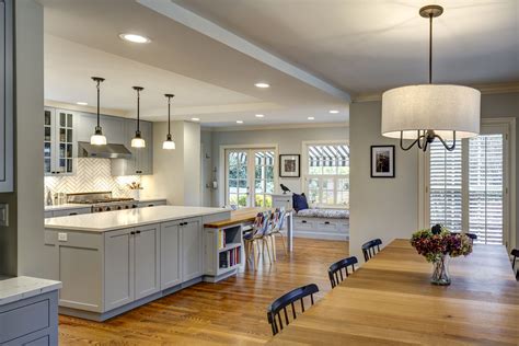 An Open Kitchen And Dining Room With Hardwood Floors