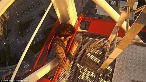 Terrifying Moment Climber Hangs From Crane By One Hand At Southampton