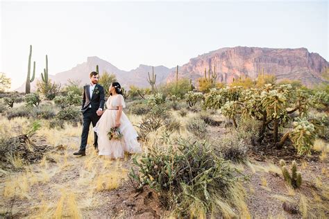 Bride And Groom Walking Together During Their Superstition Mountain