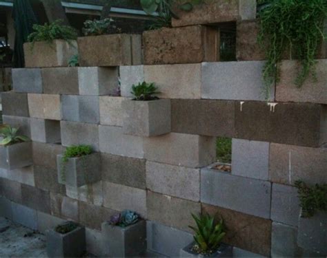 Another great reason to use cinder blocks in your landscaping is because they can be painted and decorated so easily. Cinder block plant wall | Succulent planter diy, Cinder ...