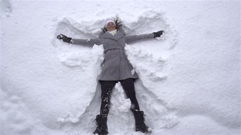 Slow Motion Young Woman Making Snow Angels Stock Footage Video 4308560