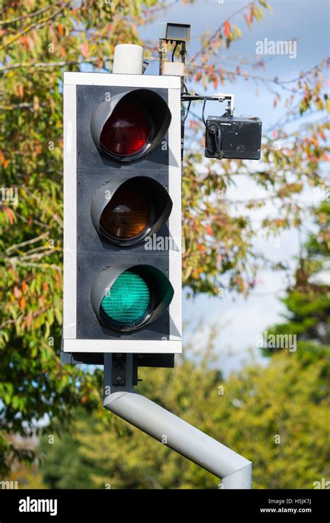 Traffic Lights With Camera At A Pedestrian Crossing In The Uk Stock