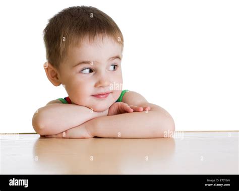Boy Sitting At Table Isolated Stock Photo Alamy