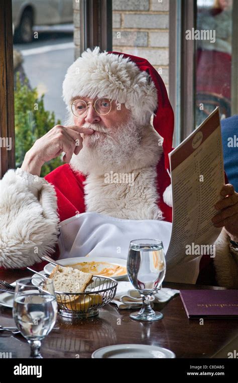 Santa Claus Eating Lunch In Nyc Restaurant Window During Xmas Holiday