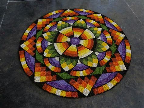 Which is then filled with flowers of complementing colors. Beutiful flower rangoli.... | Pookalam design, Rangoli ...