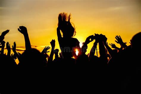 The Crowd Enjoys The Summer Music Festival The Sunset Stock Image