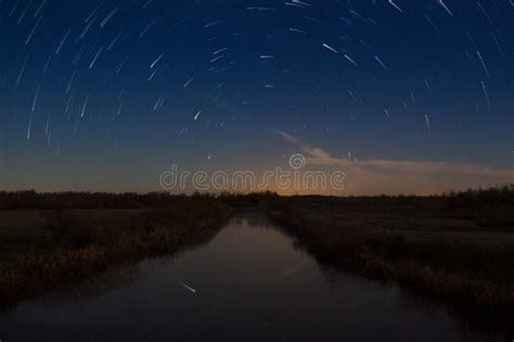Beautiful Night Sky Milky Way Star Trails And The Trees Stock Photo