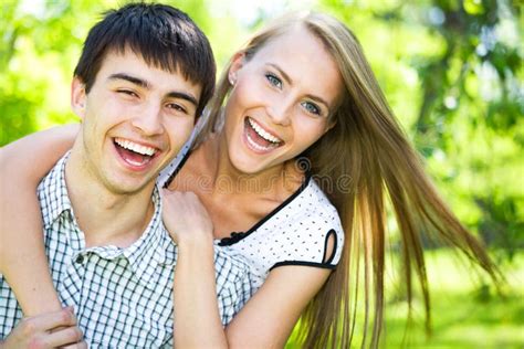 Young Woman Embracing Her Boyfrend Stock Image Image Of Casual