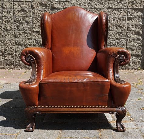 Antique Leather Chippendale Style Wingback Chair With Hand Carved Claw