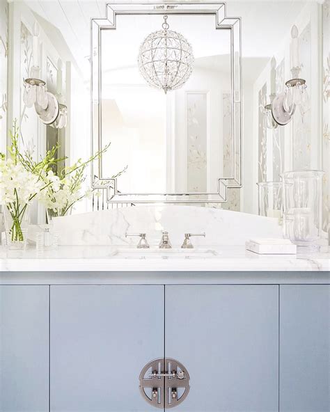 Add a few mirrors in your home to both add light and create the illusion of more space. Mirror over mirrored wall | Round mirror bathroom ...