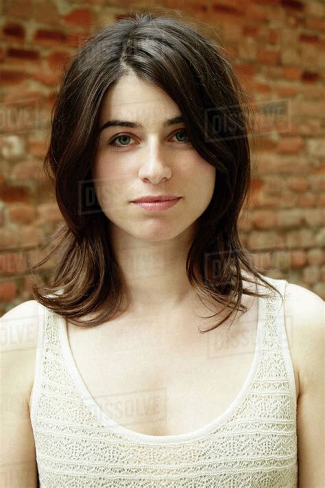Portrait Of Beautiful Italian Woman In Front Of Brick Wall Milan Italy Stock Photo Dissolve