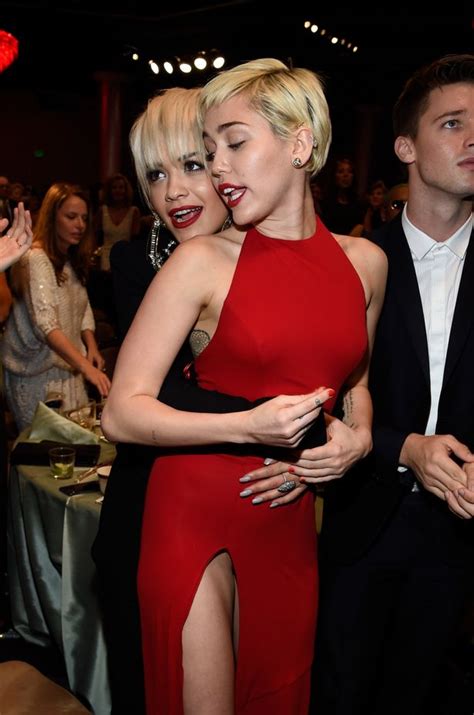 Miley Cyrus And Rita Ora Match Lipsticks And Hairstyles At Grammys