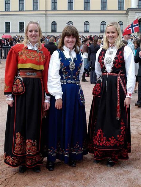 three norwegians in national costume in front of the royal palace 2008 in oslo norway