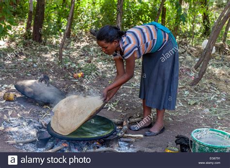 A Young Woman Making Injera Ethiopian Flat Bread Lalibela Ethiopia